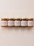 Kit Colección Completa de 5 frascos de miel fermentada alineados